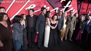 Anne Hathaway directed photographers at the red carpet premiere of 'Verity'