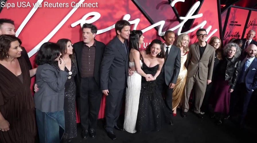 Anne Hathaway directed photographers at the red carpet premiere of 'Verity'