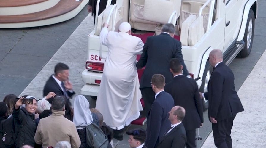Pope Francis appears unable to climb steps into popemobile