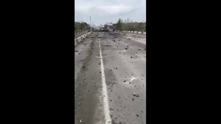 Cratered road near Kyiv taken by local Ukraine woman 