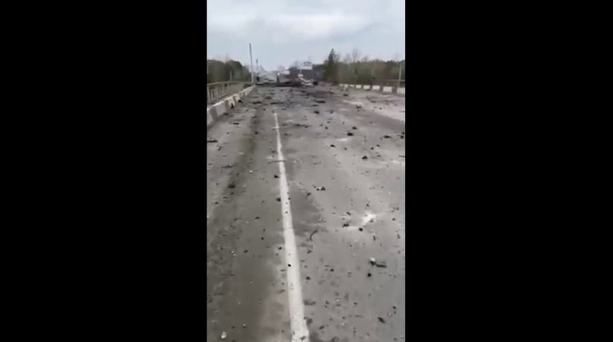 Cratered road near Kyiv taken by local Ukraine woman 