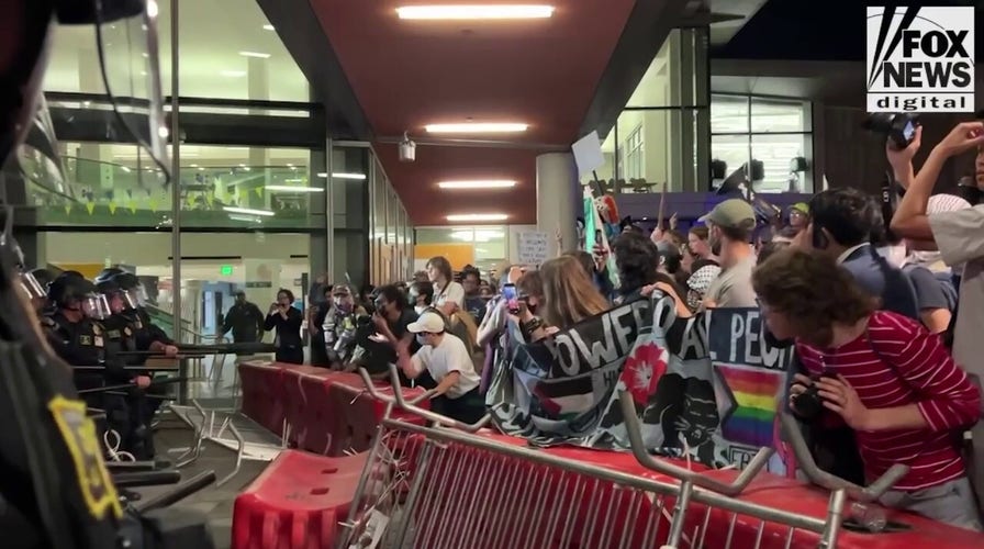 Police clasp  agitators backmost  with barricades extracurricular  Berkeley TPUSA event