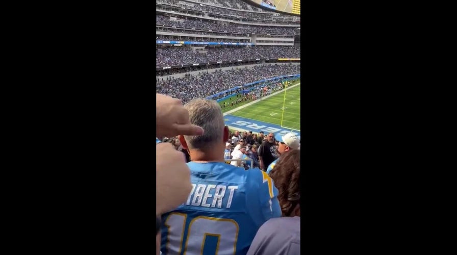 NFL fans fight at SoFi Stadium during Chargers-Raiders game