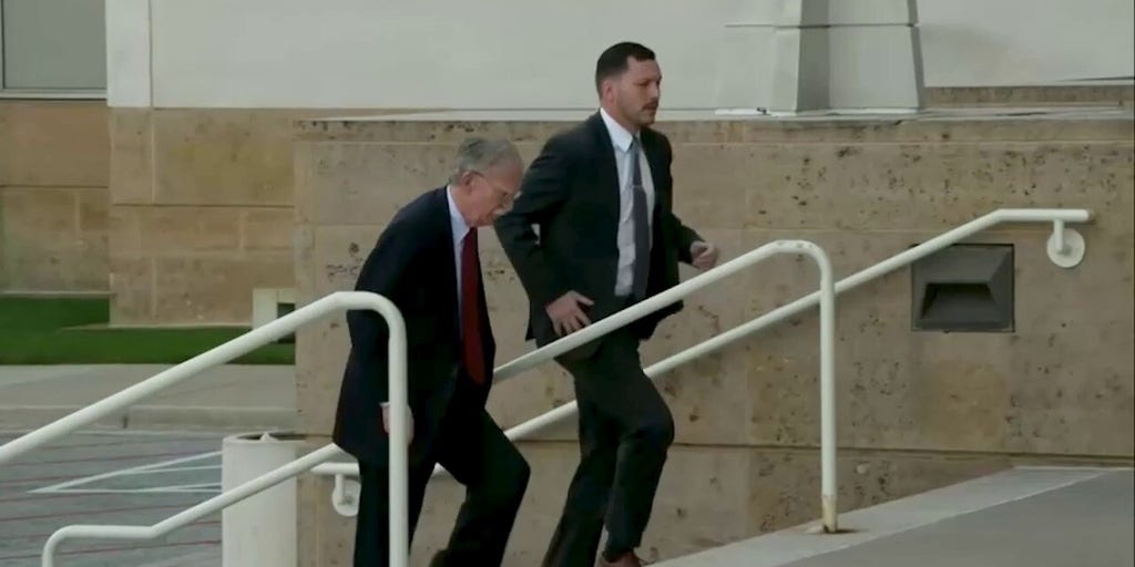 John Bolton arrives at federal courthouse to turn himself in