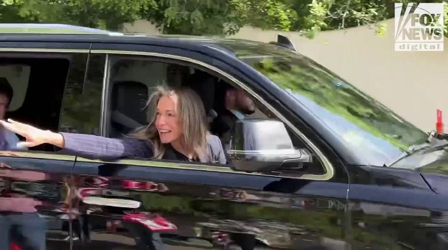 Karen Read greets supporters on her way to court