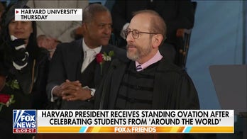 Harvard president takes shot at Trump in commencement speech