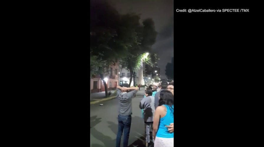 People in Mexico rush outdoors after 6.8 magnitude earthquake