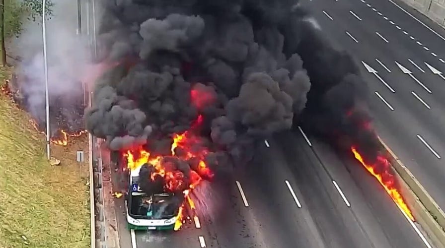 Passengers flee bus engulfed in flames