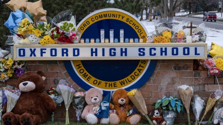 Parents of Michigan school shooting survivors sue school district for $  100M 