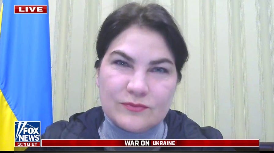 Ukrainian troops on the ground collecting war crime evidence