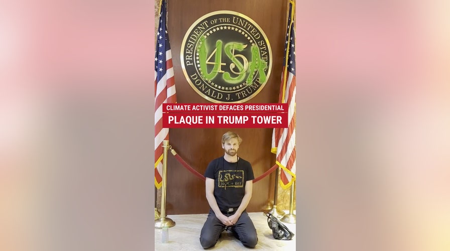 Climate activist arrested for defacing presidential plaque in Trump Tower