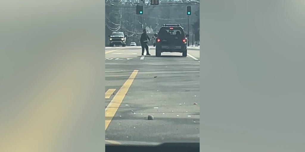 Suspect swings ax at car in apparent road rage incident