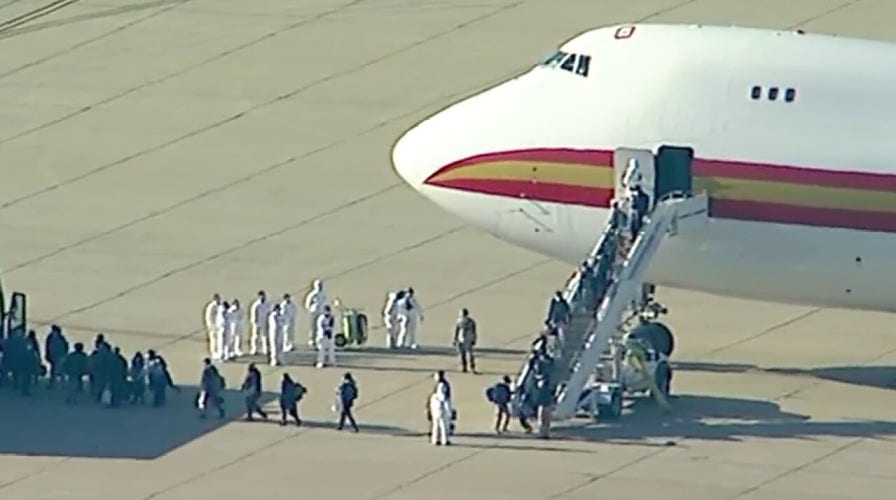 Evacuated Americans deplane from chartered flight from Chinese epicenter of coronavirus outbreak