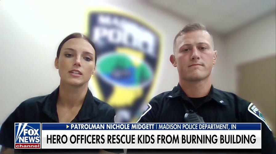 Indiana police officers rescue kids from burning building