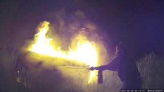 New York police officer, Good Samaritan motorists help rescue woman from car engulfed in flames