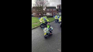 Watch this bereaved young boy lead a police procession on his new mini police bike - Fox News