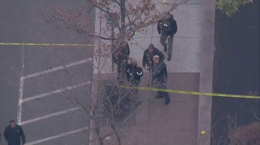 Law enforcement responds to an officer-involved shooting at a Philadelphia federal building
