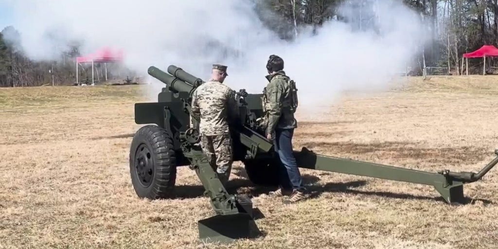 Vance fires off weapons with Marines at Quantico