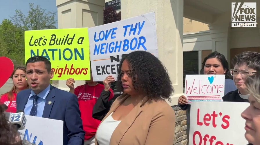 Orange County representatives speak at a press conference outside of the Crossroads Hotel