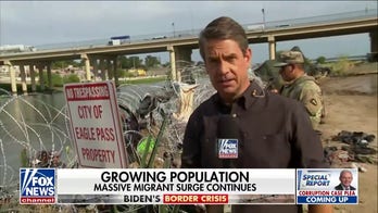 Razor wire fails to deter migrants as thousands try to cross