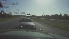 Florida officer puts herself between speeding drunk driver and runners in 10K, dashcam video shows