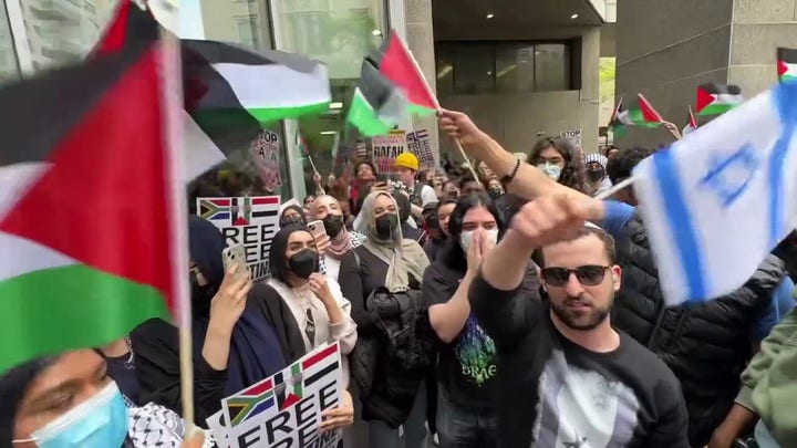 Anti-Israel protesters shout at man waving Israeli flag in NYC