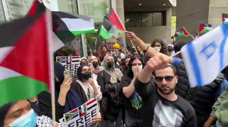 Anti-Israel protesters shout at man waving Israeli flag in NYC