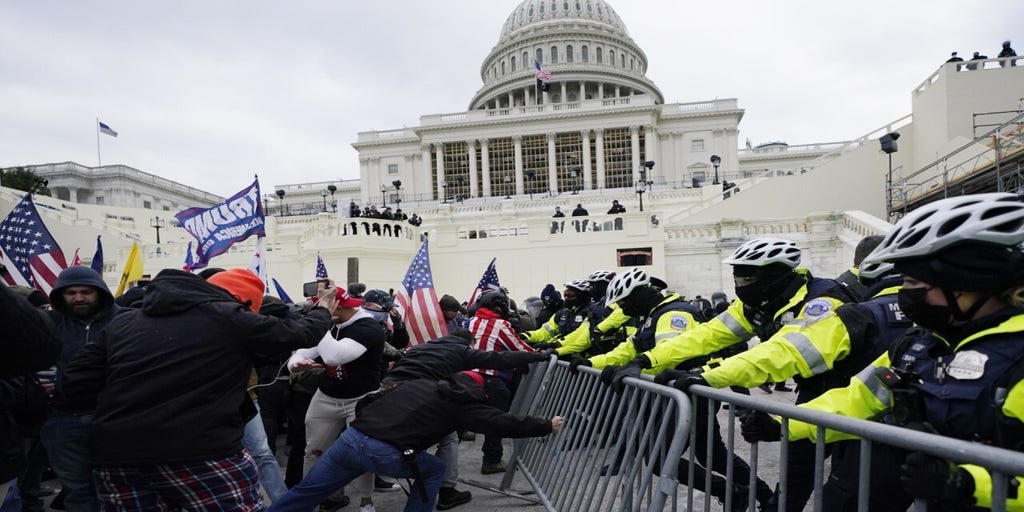 Rioters and DC police on Capitol Hill