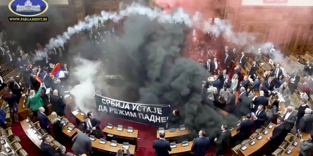 Serbian lawmakers throw smoke grenades, tear gas in parliament