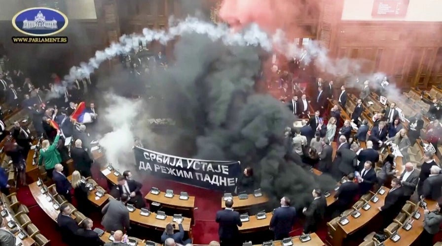 Serbian lawmakers throw smoke grenades, tear gas in parliament