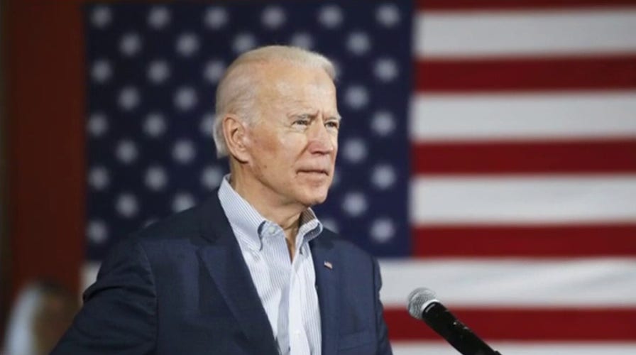 Biden slammed for coughing in his hand