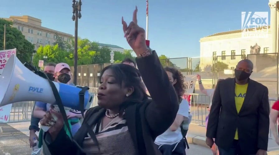 Rep. Cori Bush speaks to protestors outside of the Supreme Court Building