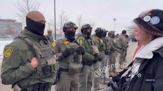 Border Patrol agent hugs Minnesota protester amid rising tensions