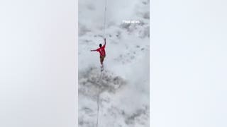 Challenger walks slackline high above ROARING canyon waters in China