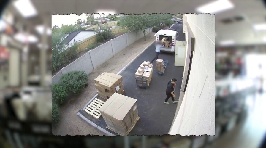 Postal worker caught on camera throwing packages