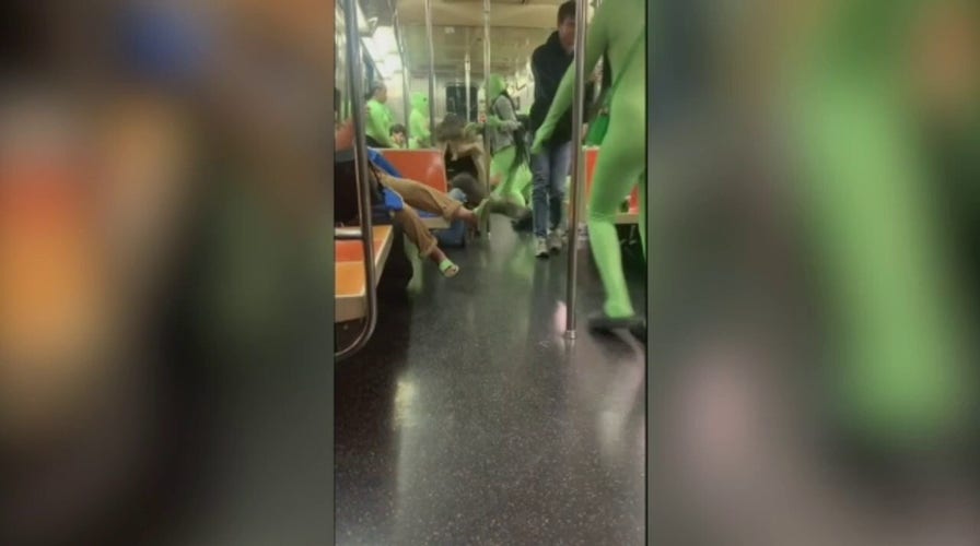 Group of women dressed in green bodysuits attack women on the NYC subway