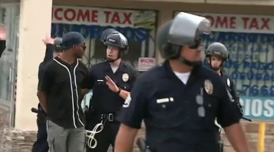 Neighbors protecting Los Angeles business from looters handcuffed on live TV