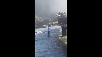 Tourist caught on camera risking deadly drop to retrieve phone at popular waterfall