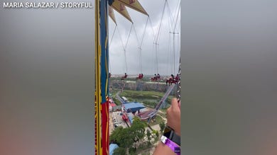 Six Flags riders stranded midair after operator halts 200-foot swing ride