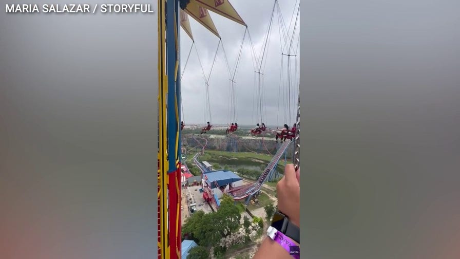 Six Flags riders stranded midair after operator halts 200-foot swing ride