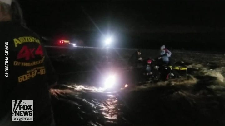 Dramatic video: Family of five and dog saved from flash flooding