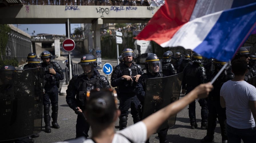 Protests erupt in France against COVID health passes