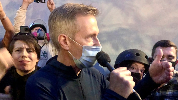 Portland mayor shouted down, tear-gassed during downtown visit to address protesters