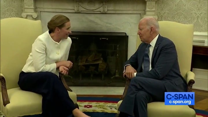 President Biden smirks and laughs as reporters escorted out room