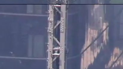 Masked man proposes to woman on Empire State Building spire