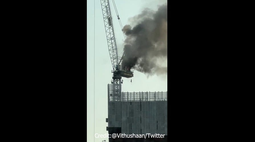 New York crane leaves smoke trail