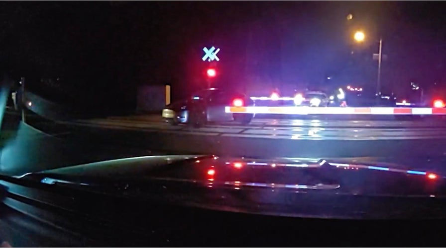 Rescue Nation: Heroic Officers Pull Unresponsive Driver From Train Tracks