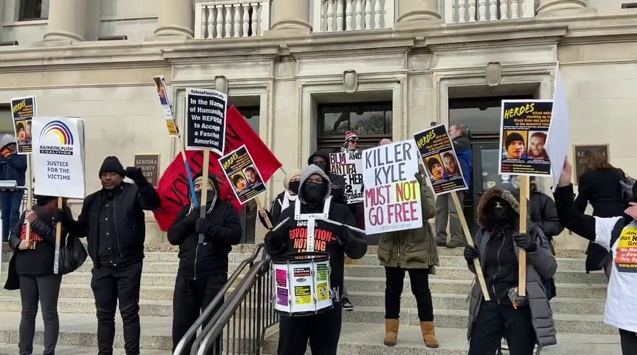 Protesters gather outside of the Kenosha County Courthouse to protest Kyle Rittenhouse