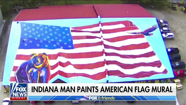 Indiana man paints American flag mural on roof of hardware store