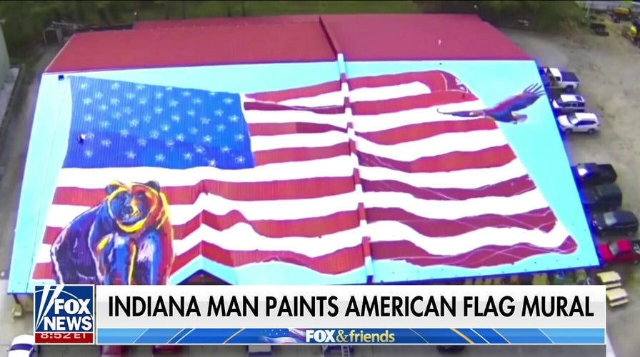 Indiana man paints American flag mural on roof of hardware store